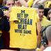 A fan is given a t-shirt during ESPN's "College GameDay" at Ingalls Mall on the University of Michigan campus on Saturday, September 7, 2013. Melanie Maxwell | AnnArbor.com